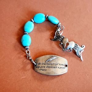 Turquoise stone with two pendants silver tone.